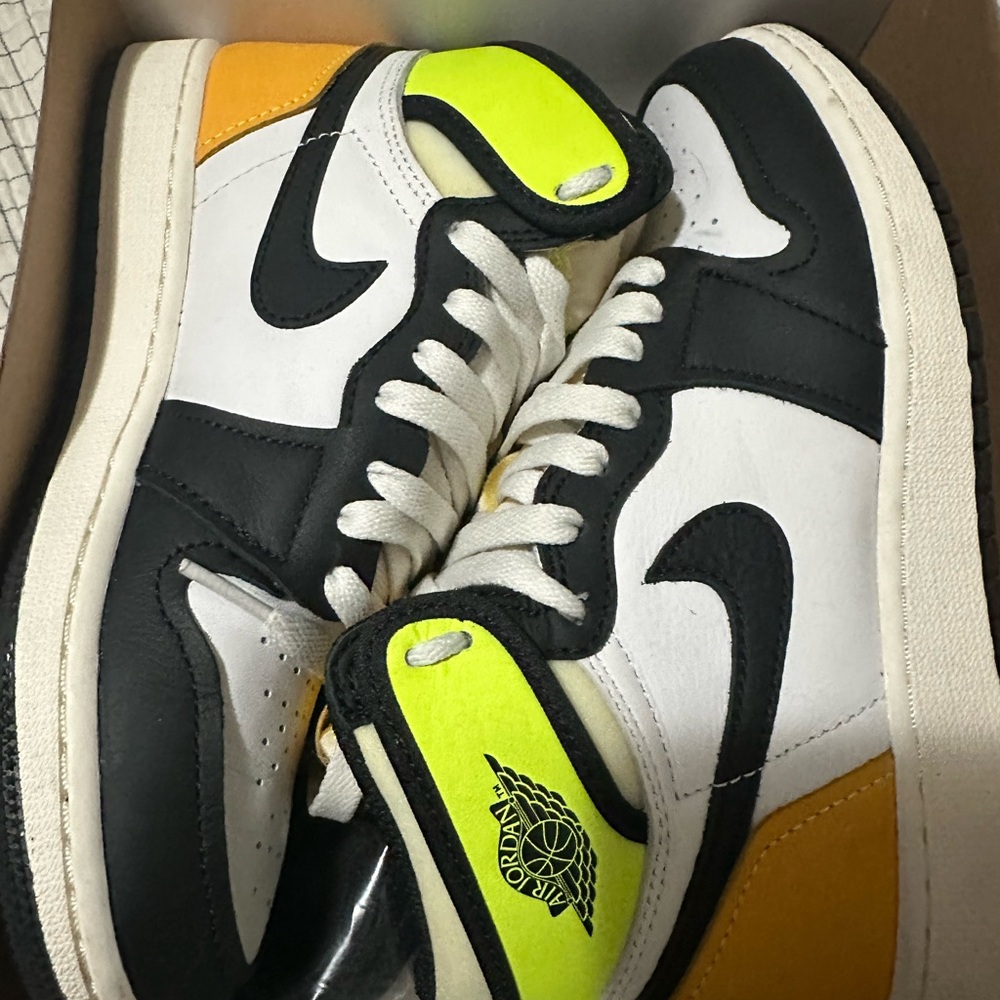Jordans boys size 4.5 Black, White, and Yellow Sneakers